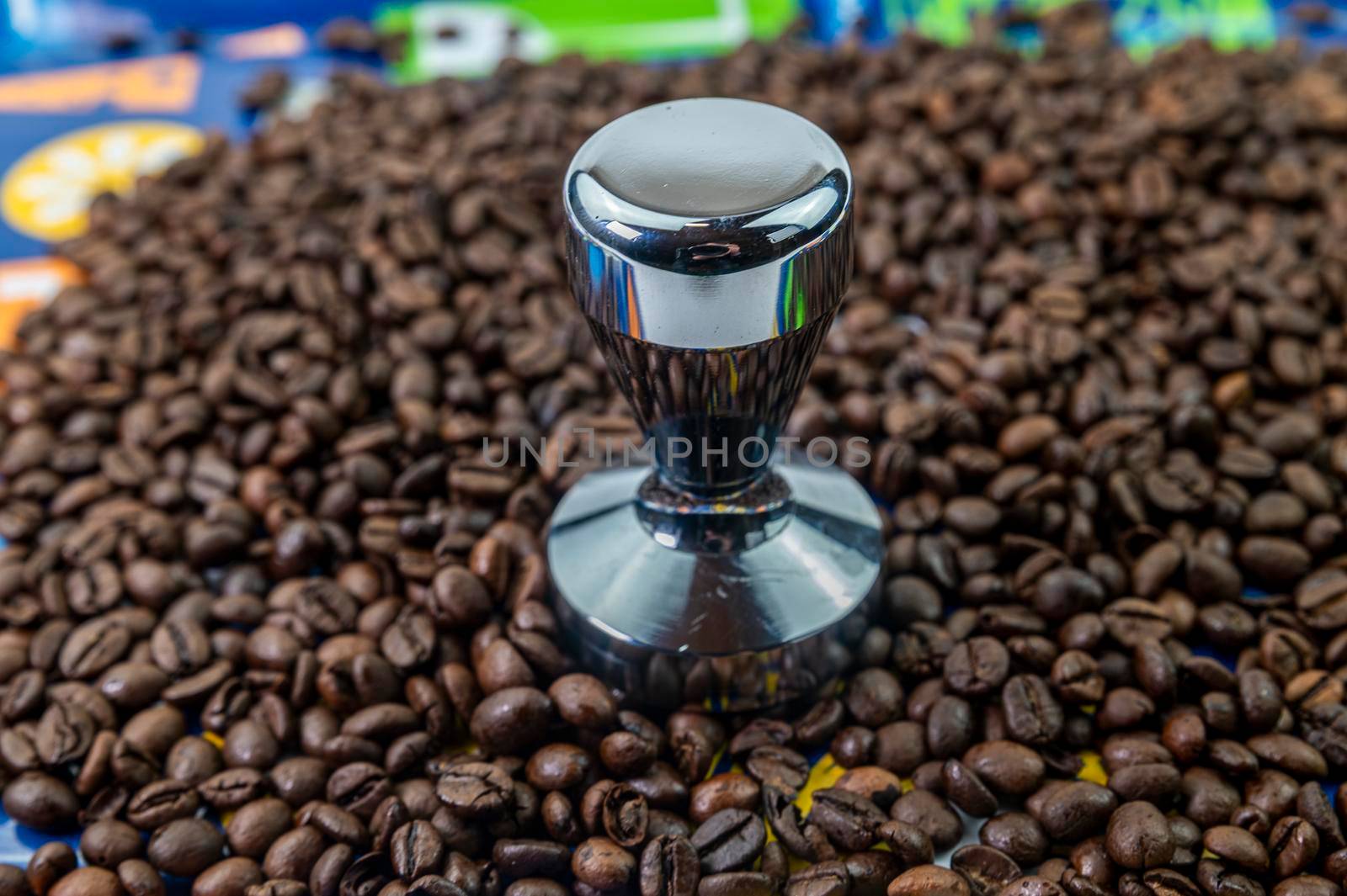 coffee beans with steel coffee press for bars