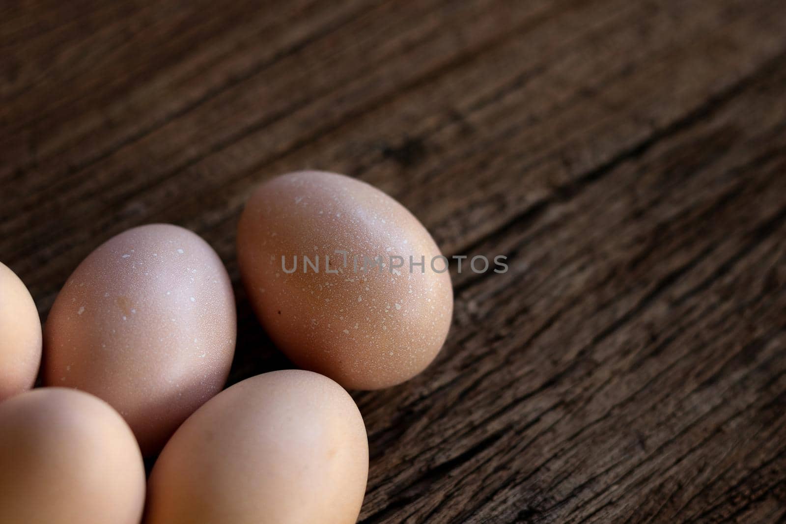 Hen eggs on wood background. Top View.