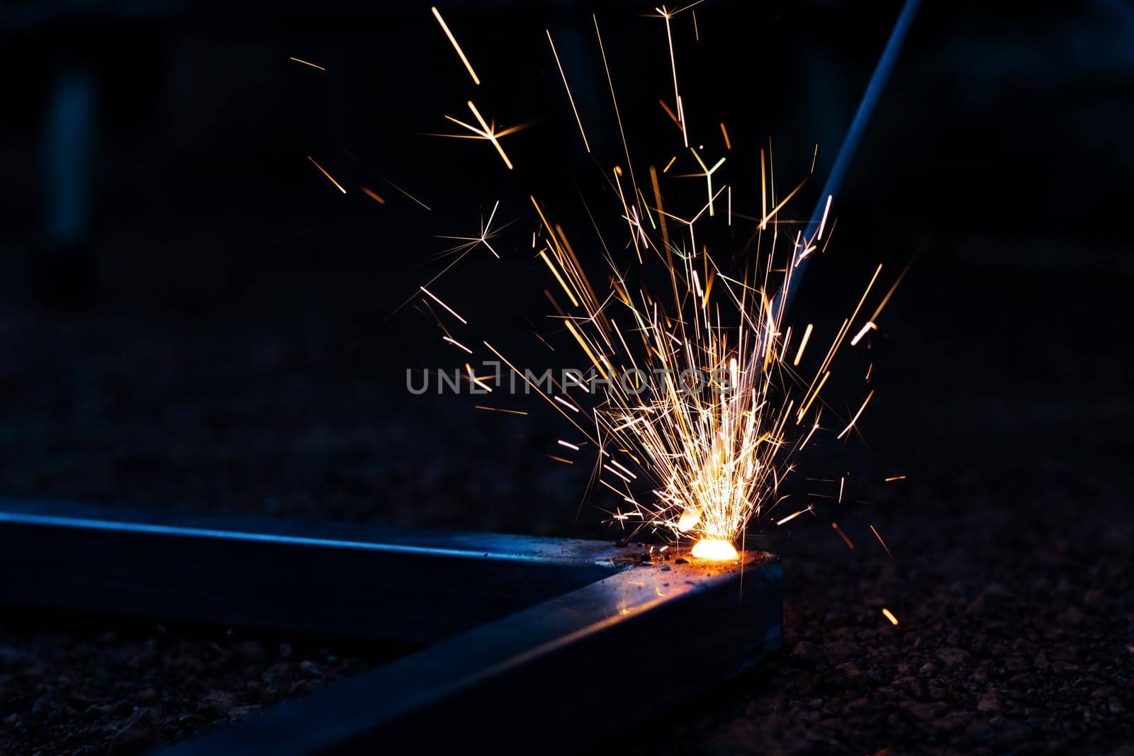 Technician focus on welding process on spark light with equipment.