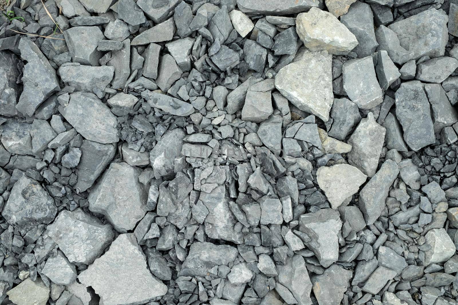 Crushed stone. Gravel texture or gravel background. Closeup pile of crushed gravel texture.