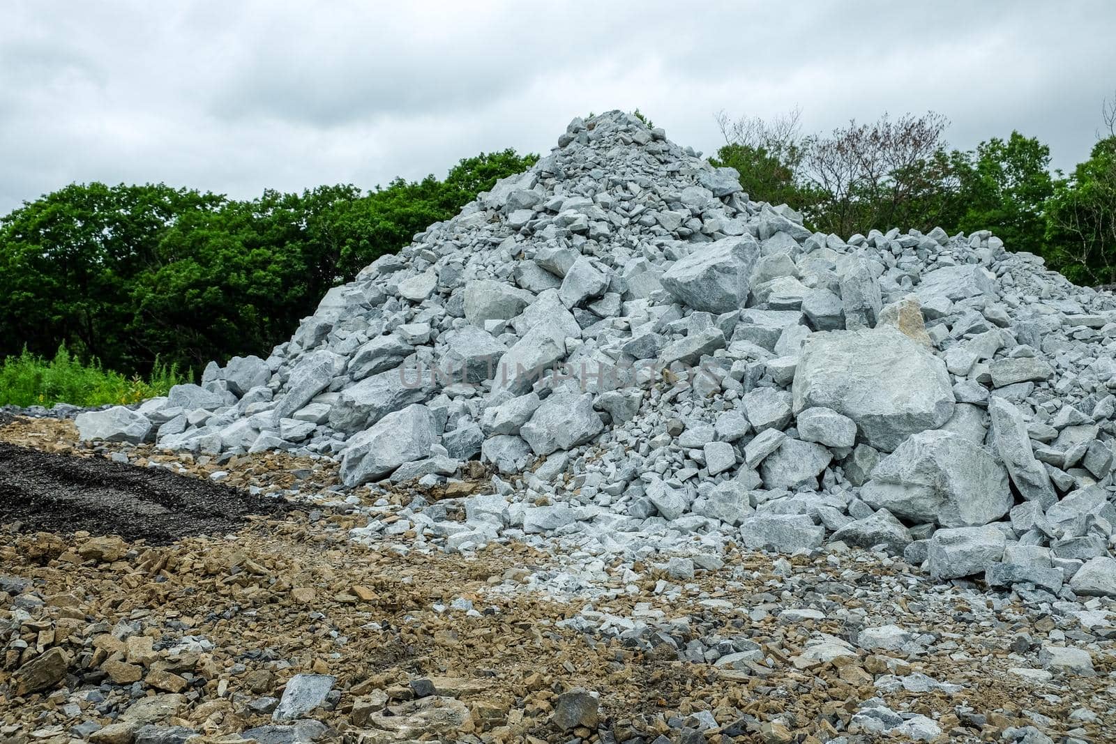 A pile of building crushed stone crushed stone at a construction site.