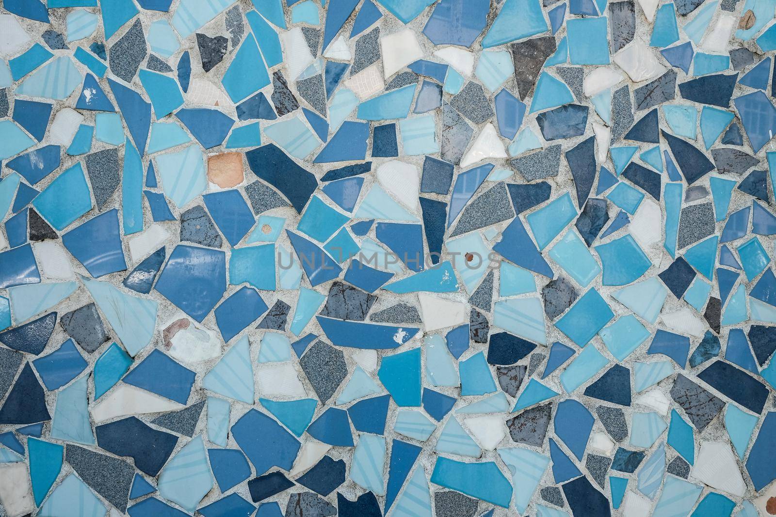 Colorful ceramic mosaic floor or wall. mosaic top view. Bathroom or kitchen floor wall design idea. Reused broken tile. Interior design. Colored eastern pottery.