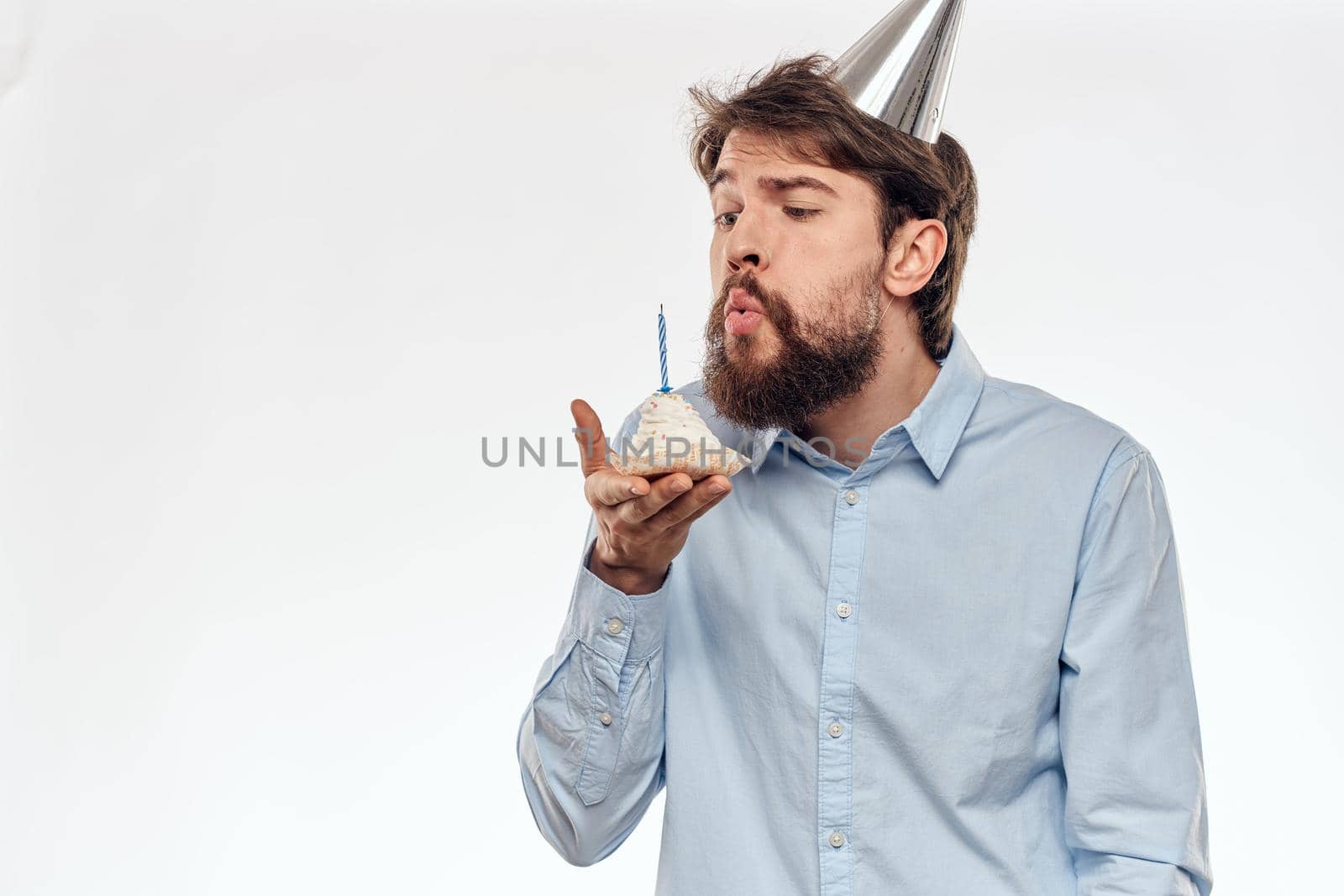 Happy guy with birthday cake white background Compact corporate party cropped beard view. High quality photo