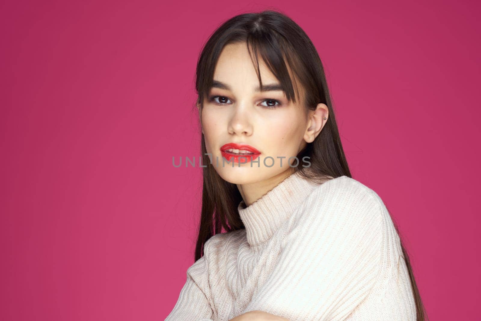 Woman with long hair and red lips white blouse pink background attractive look by SHOTPRIME