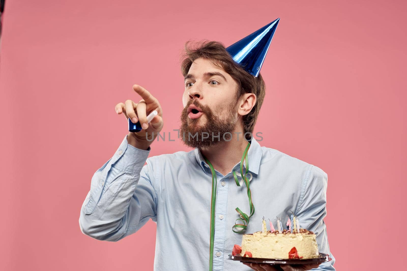 Bearded man with cake on pink background birthday party corporate emotions model loneliness by SHOTPRIME