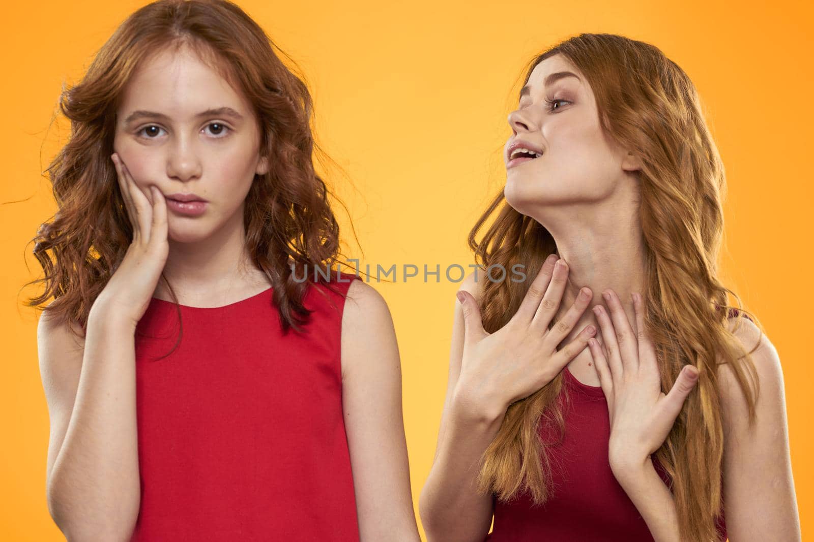 Mom and daughter in red dresses entertainment lifestyle yellow background by SHOTPRIME
