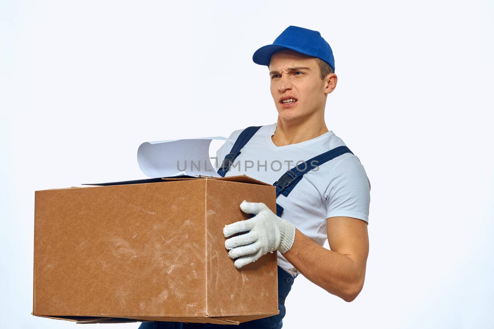 Man in working uniform sound volume delivery Professional. High quality photo
