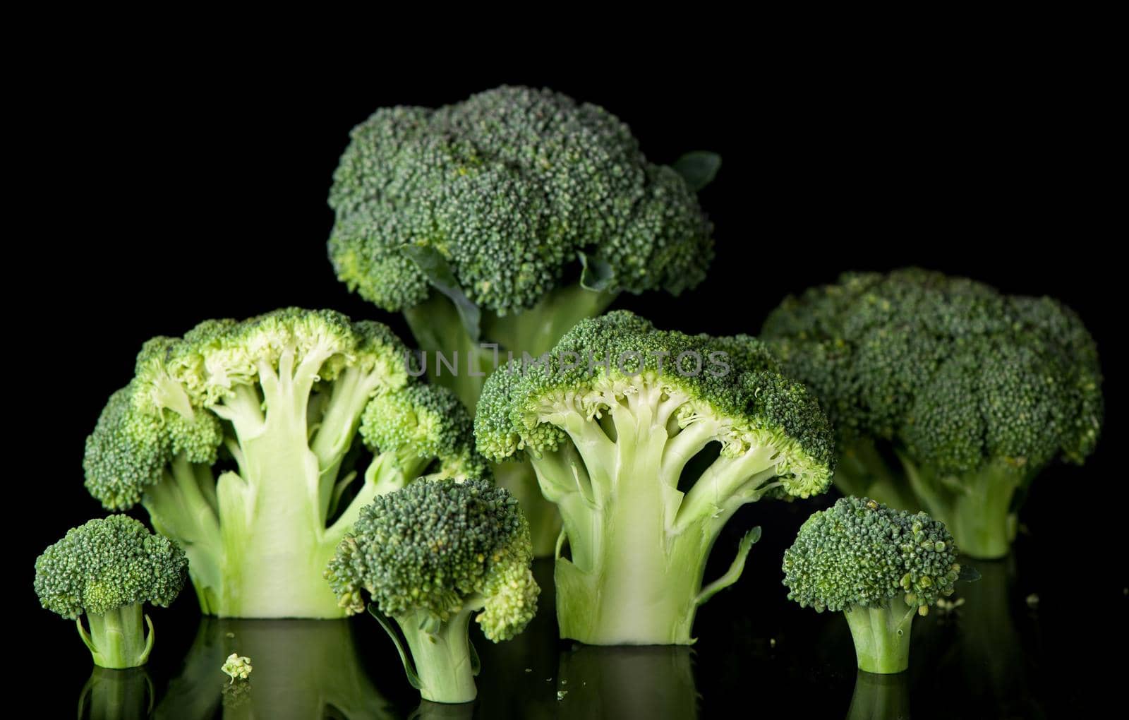 Fresh broccoli cabbage isolated on black background by aprilphoto