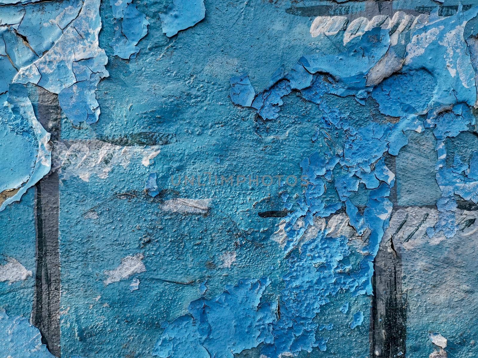 Blue background with cracked oil paint on plaster. For design and networking.