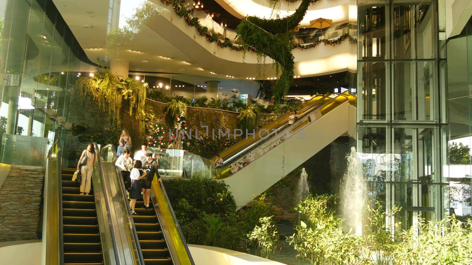 BANGKOK, THAILAND - 18 DECEMBER, 2018 The Emquartier luxury shopping center. Design of mall, green environmentally friendly concept. hanging garden, futuristic eco architecture. Modern city. Escalator