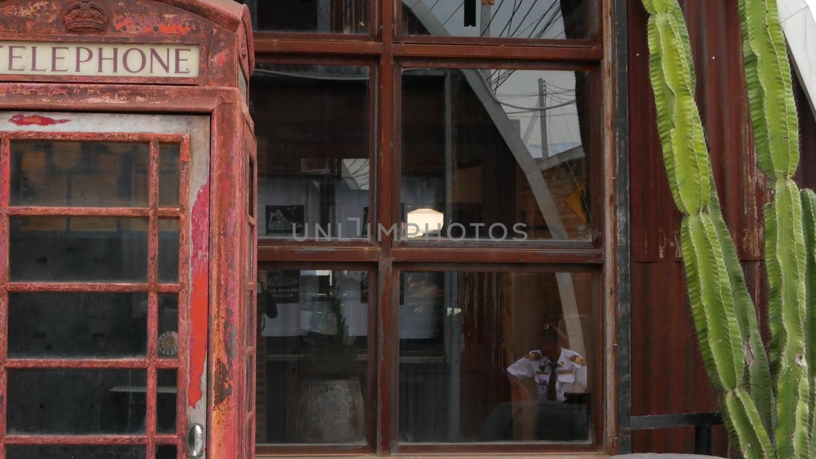 BANGKOK, THAILAND - 10 JULY, 2019: The camp vintage flea market near Chatuchak. Modern design of retro style boutique art shop of old antiques. Decoration of popular strange fashion city landmark. by DogoraSun