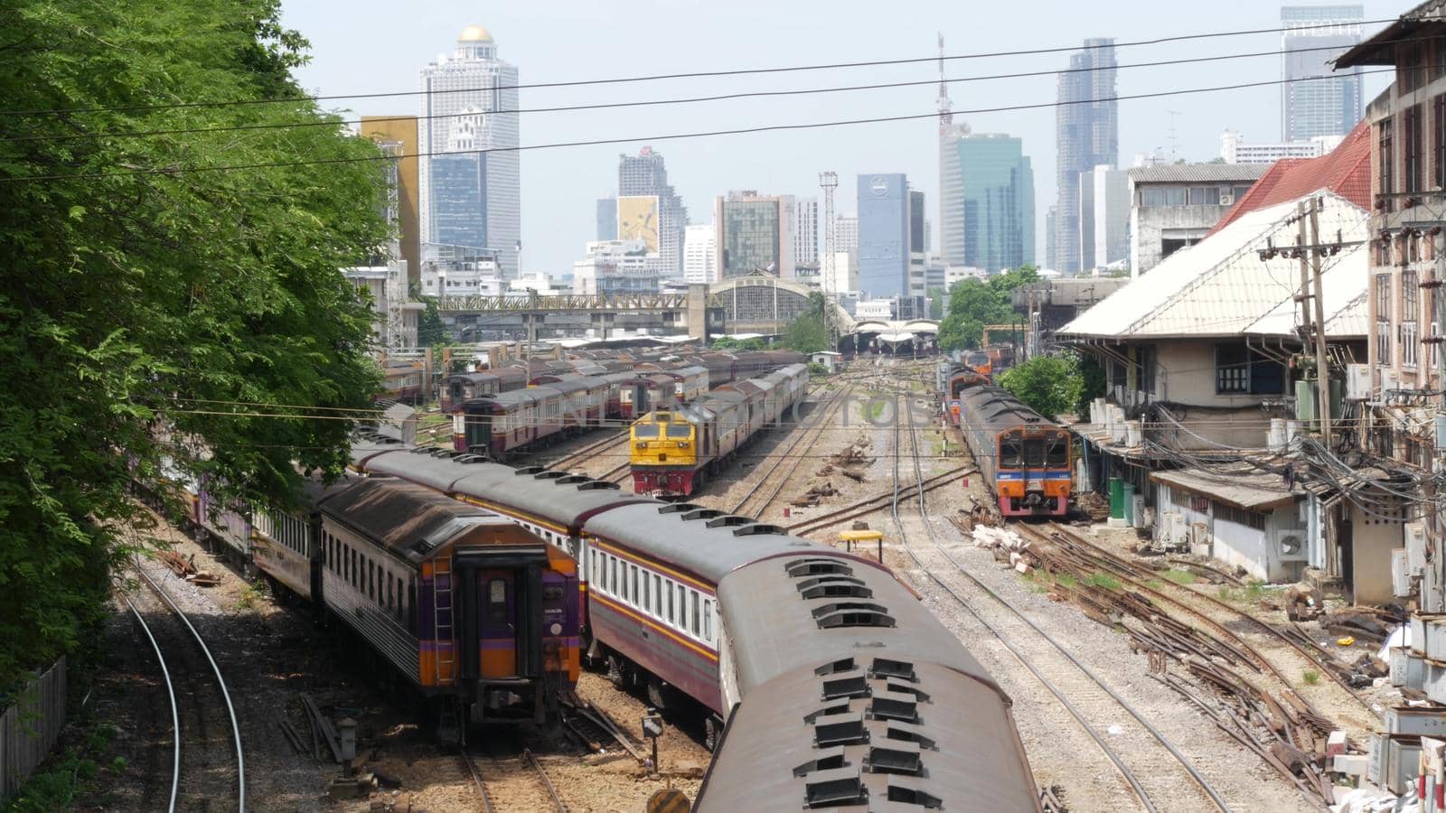 BANGKOK, THAILAND - 11 JULY, 2019: View of the train station against the backdrop of the cityscape and skyscrapers. Hua Lamphong is the hub of public transportation. State railway transport in Siam. by DogoraSun