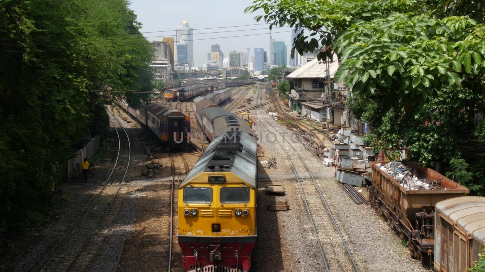 BANGKOK, THAILAND - 11 JULY, 2019: View of the train station against the backdrop of the cityscape and skyscrapers. Hua Lamphong is the hub of public transportation. State railway transport in Siam