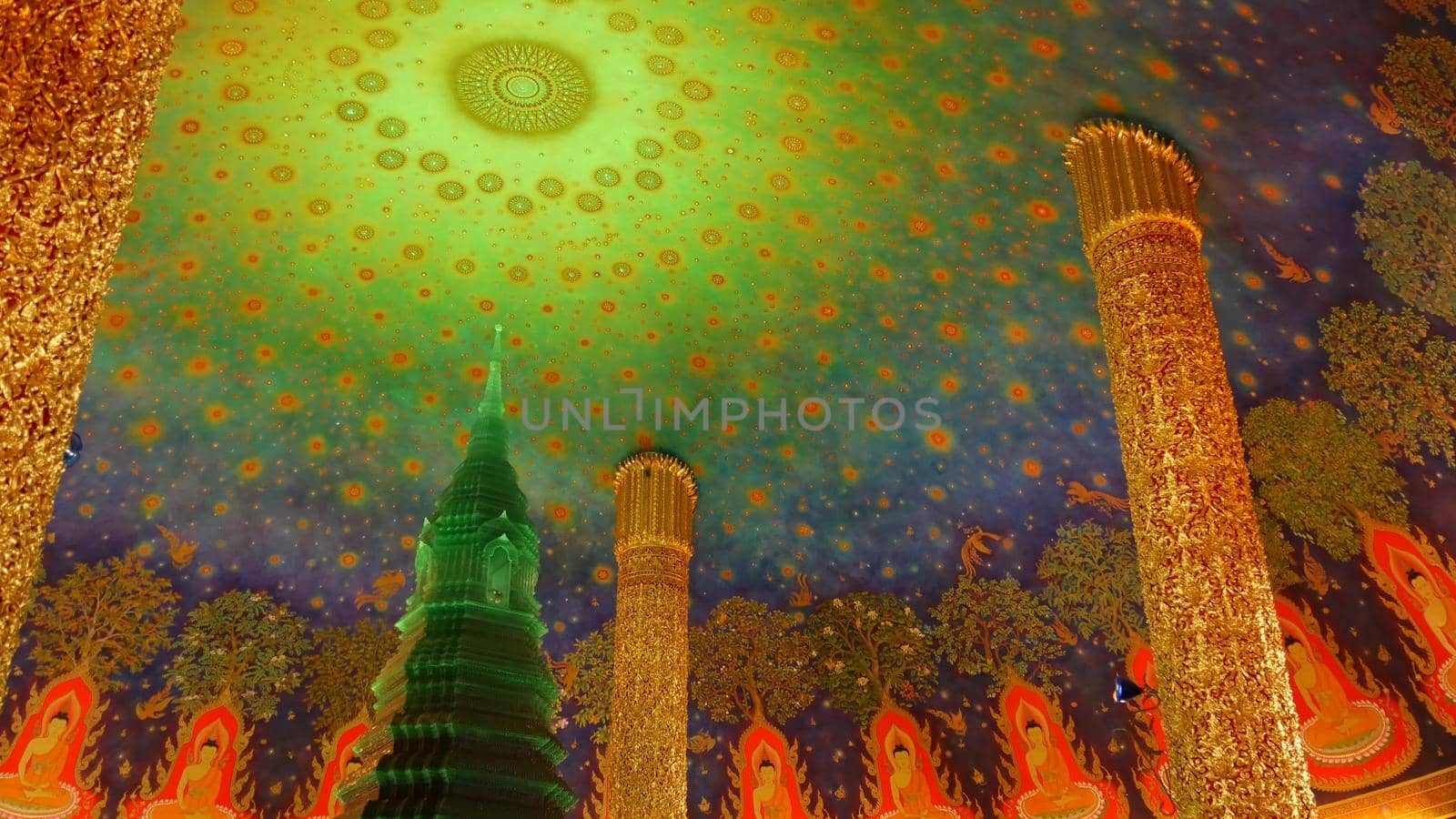 BANGKOK, THAILAND - 13 JULY, 2019: Wat Pak Nam or Paknam traditional oriental buddhist temple interior. Emerald glass stupa under vivid colorful ceiling, circular dome roof colored with acid colors.