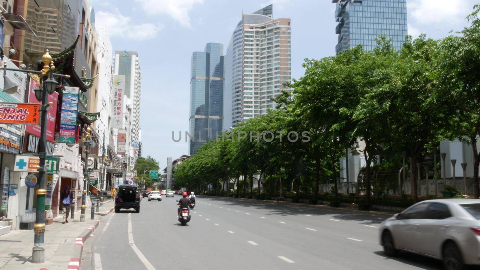 BANGKOK, THAILAND - 13 JULY, 2019: Mahanakhon King Power skyscraper in modern Sathorn financial business district. Maha Nakhon - tallest futuristic building. Rush hour traffic, cars and bts skytrain by DogoraSun