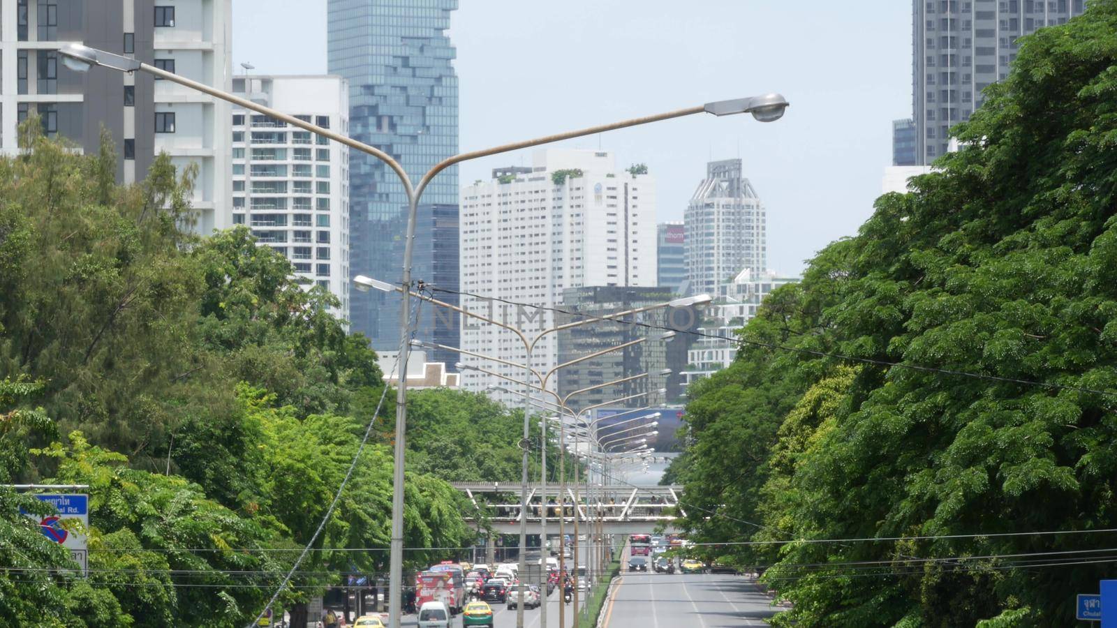 BANGKOK, THAILAND - 13 JULY, 2019: Mahanakhon King Power skyscraper in modern Sathorn financial business district. Maha Nakhon - tallest futuristic building. Rush hour traffic, cars and bts skytrain.