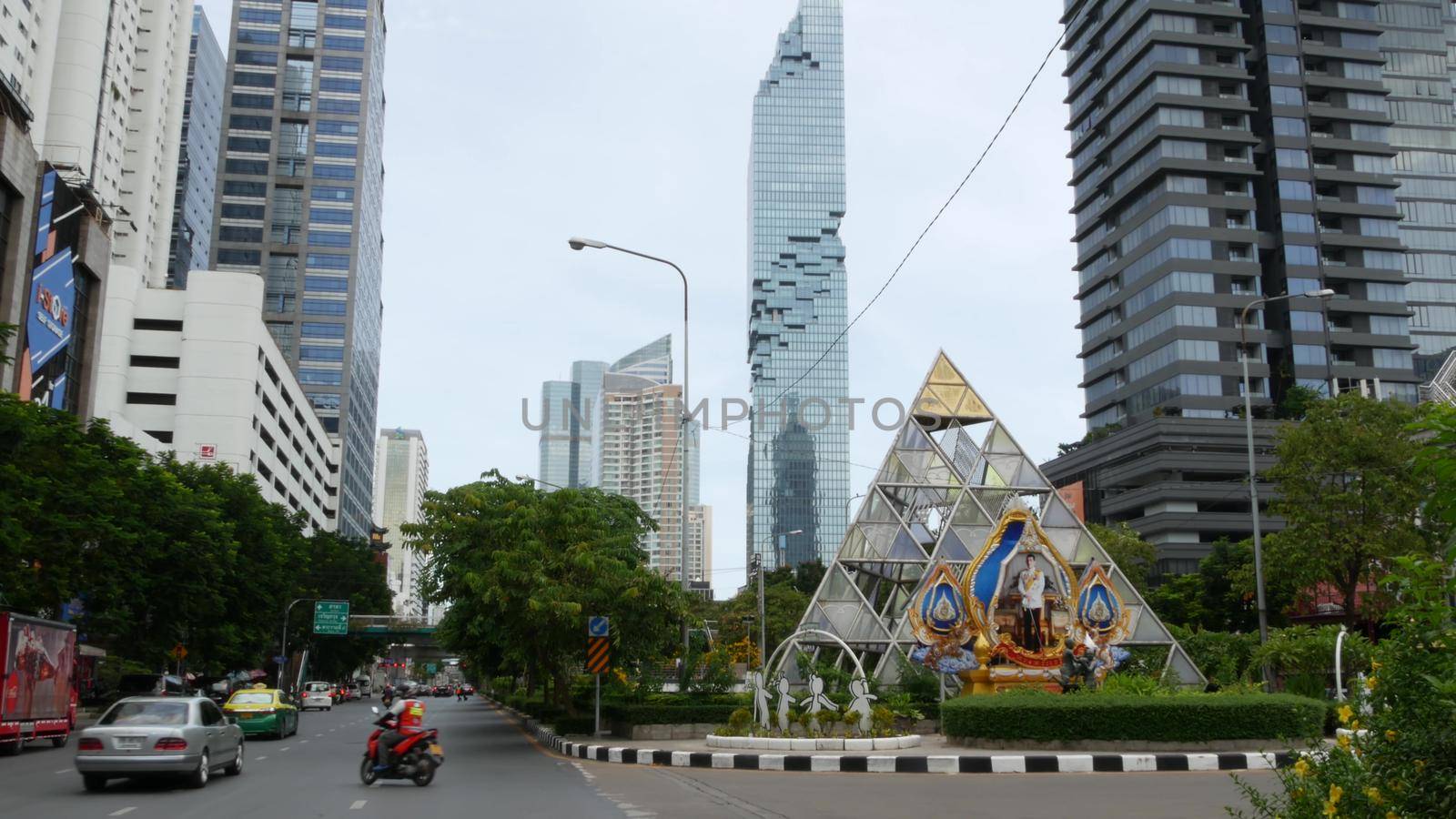 BANGKOK, THAILAND - 13 JULY, 2019: Mahanakhon King Power skyscraper in modern Sathorn financial business district. Maha Nakhon - tallest futuristic building. Rush hour traffic, cars and bts skytrain.