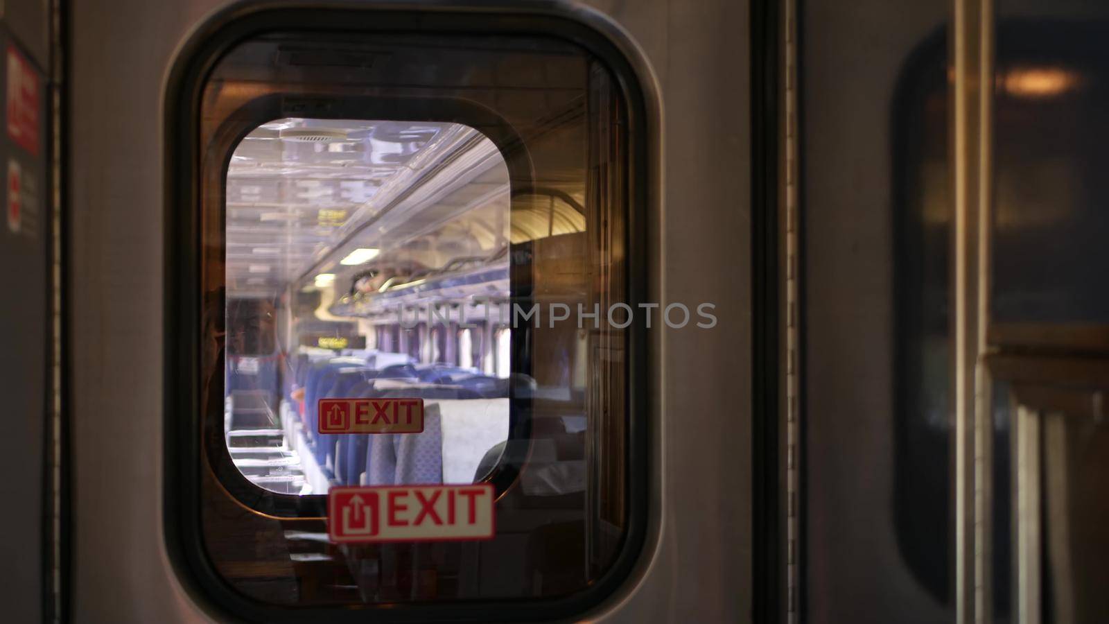 LOS ANGELES, CALIFORNIA, USA - 24 OCT 2019: Amtrak Pacific Surfliner commuter, express train car inside. Passenger rapid rail transportation along the ocean. Railway on west coast. Railroad in suburb by DogoraSun