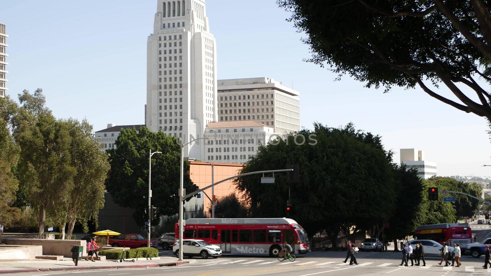 LOS ANGELES, CALIFORNIA, USA - 30 OCT 2019: People walking in metropolis, pedestrians on walkway in urban downtown. Citizens on street in financial district. City dwellers in LA among skyscrapers.