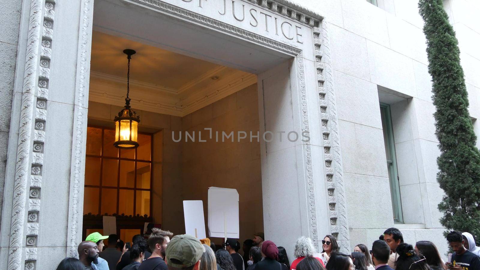 LOS ANGELES, CALIFORNIA, USA - 30 OCT 2019: People strike near Hall of Justice. Protest picket in front of Sheriff's Department and Courthouse. Demonstration of activists near LA government building by DogoraSun