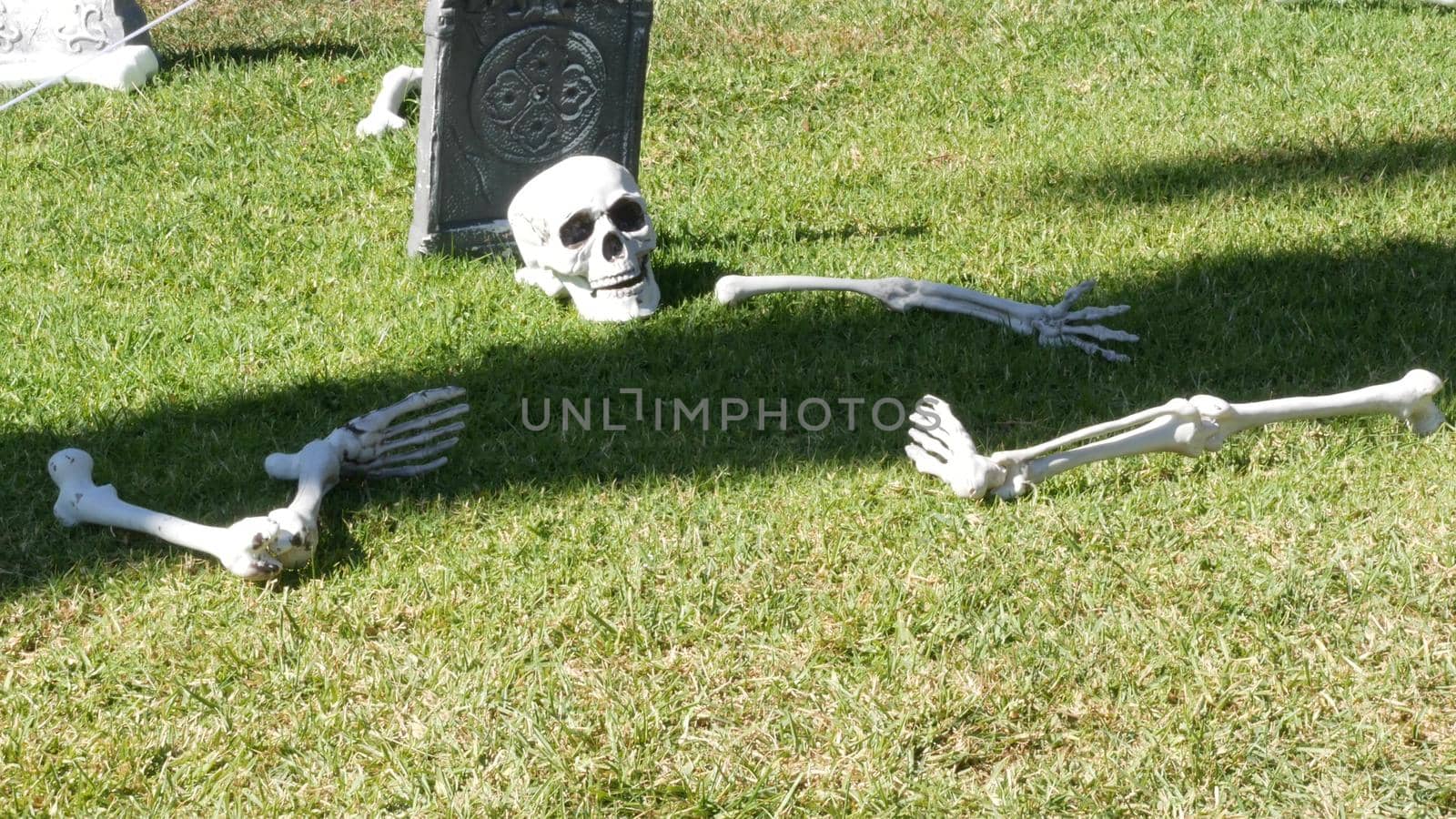 LOS ANGELES, CALIFORNIA, USA - 29 OCT 2019: Scary festival decorations of a house, Happy Halloween holiday. Classic garden with Pumpkin, Bones and Skeleton. Traditional party decor. American culture.