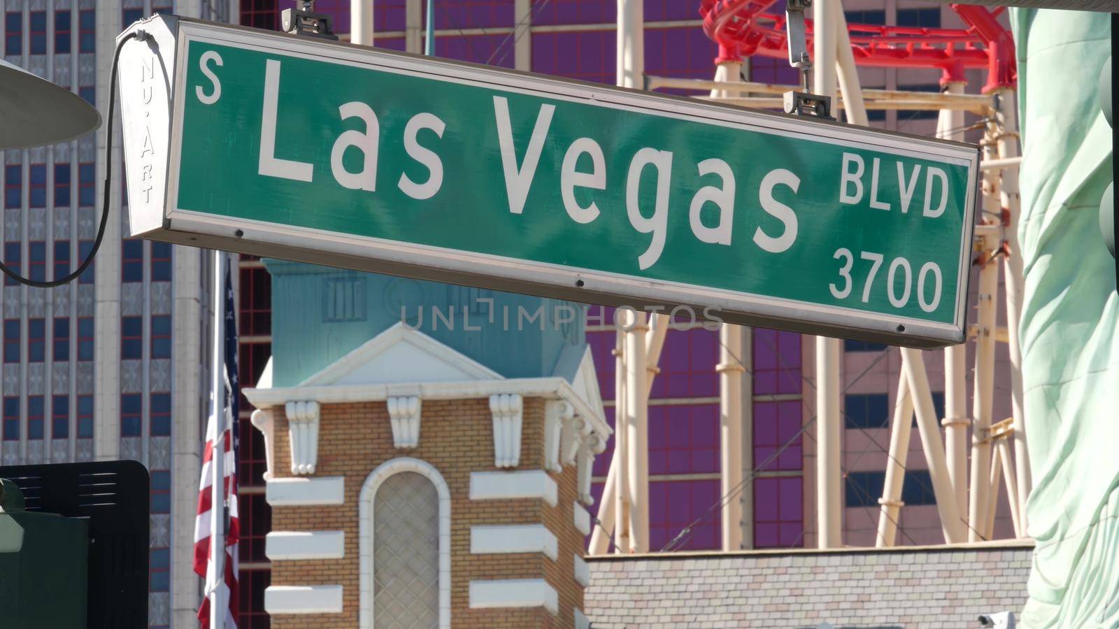 LAS VEGAS, NEVADA USA - 8 MAR 2020: Traffic sign on The Strip in fabulous sin city. Iconic signboard on road to Fremont street against New York hotel and casino. Symbol of money playing and betting by DogoraSun