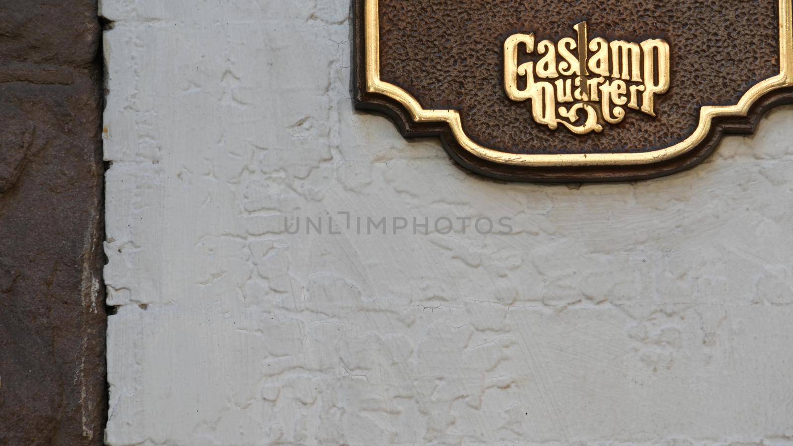 SAN DIEGO, CALIFORNIA USA - 13 FEB 2020: Historic old-fashioned Gaslamp Quarter sign on building wall. Retro signboard on 5th ave. Iconic vintage nameplate signage. Tourist landmark and sightseeing.