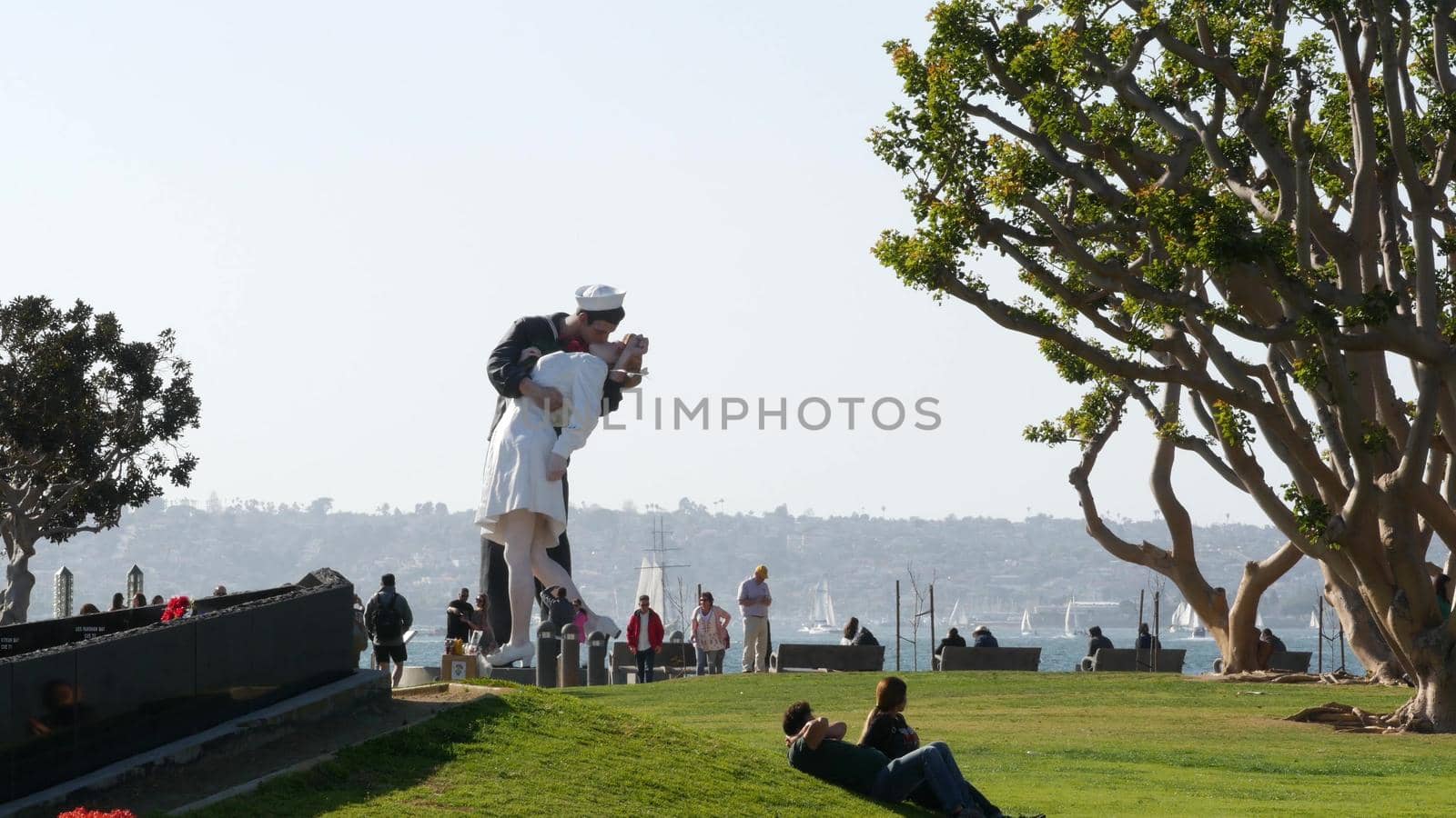 SAN DIEGO, CALIFORNIA USA - 23 FEB 2020: Unconditional Surrender Statue, USS Midway Museum. Symbol of navy fleet and Victory over Japan Day. Sailor kissing a woman, World War II memorial sculpture by DogoraSun