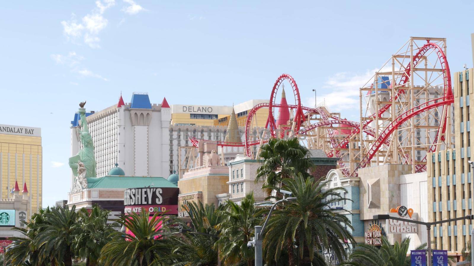 LAS VEGAS, NEVADA USA - 7 MAR 2020: The Strip boulevard with luxury casino and hotel in gambling sin city. Road to Fremont street in tourist money playing resort. New York-New York and roller coaster by DogoraSun