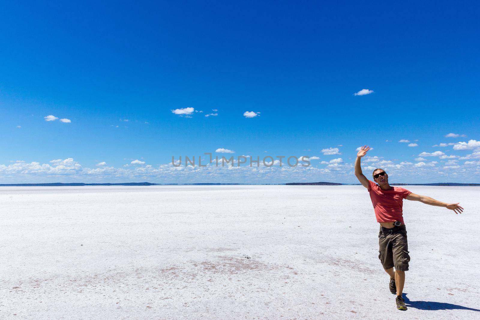 time to relax for a man walking on a salt lake in western