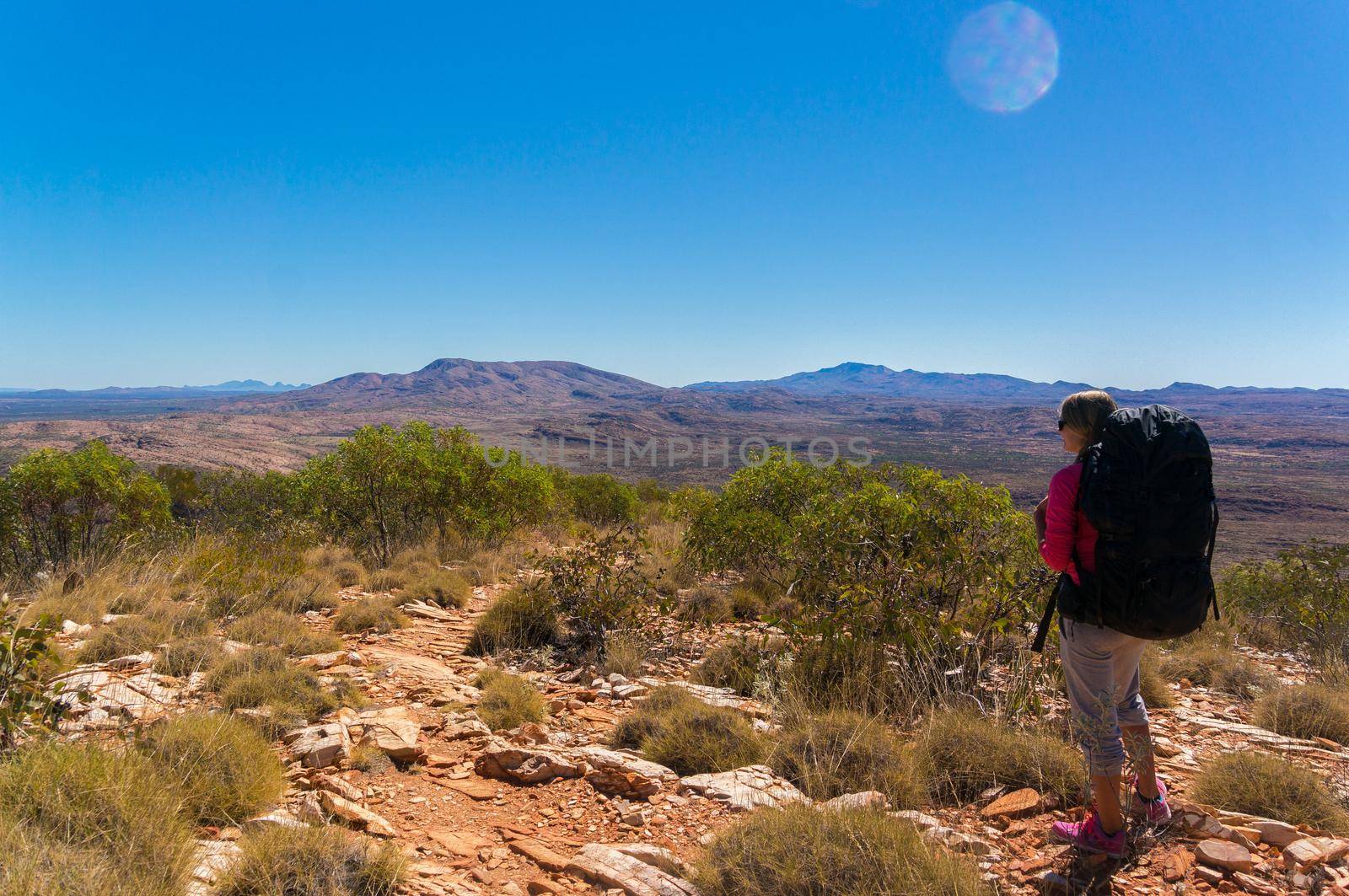 Hiker at the top of Mount Gillen just outside Alice Springs in central Australia.