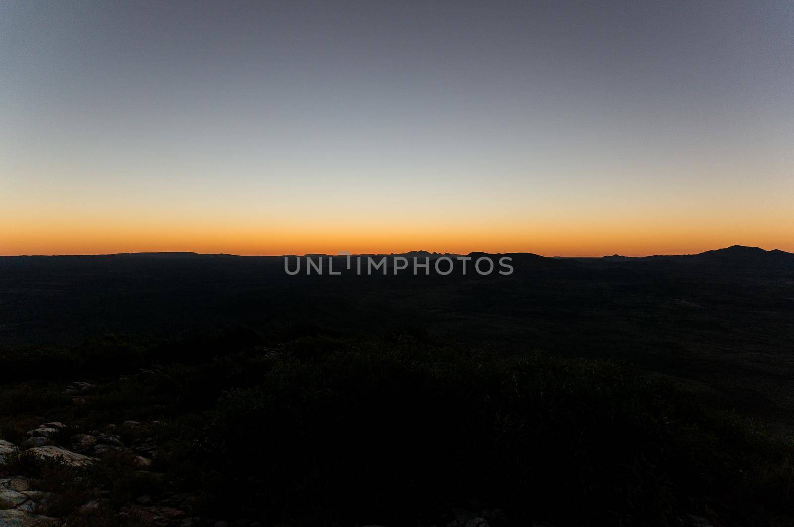 Hiker at the top of Mount Gillen just outside Alice Springs in central Australia.