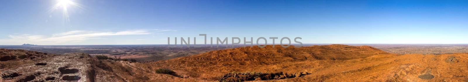 panorama view from the uluru after hiking up the Uluru with kata tjuta in the distance, ayers Rock, the Red Center of Australia, Australia by bettercallcurry