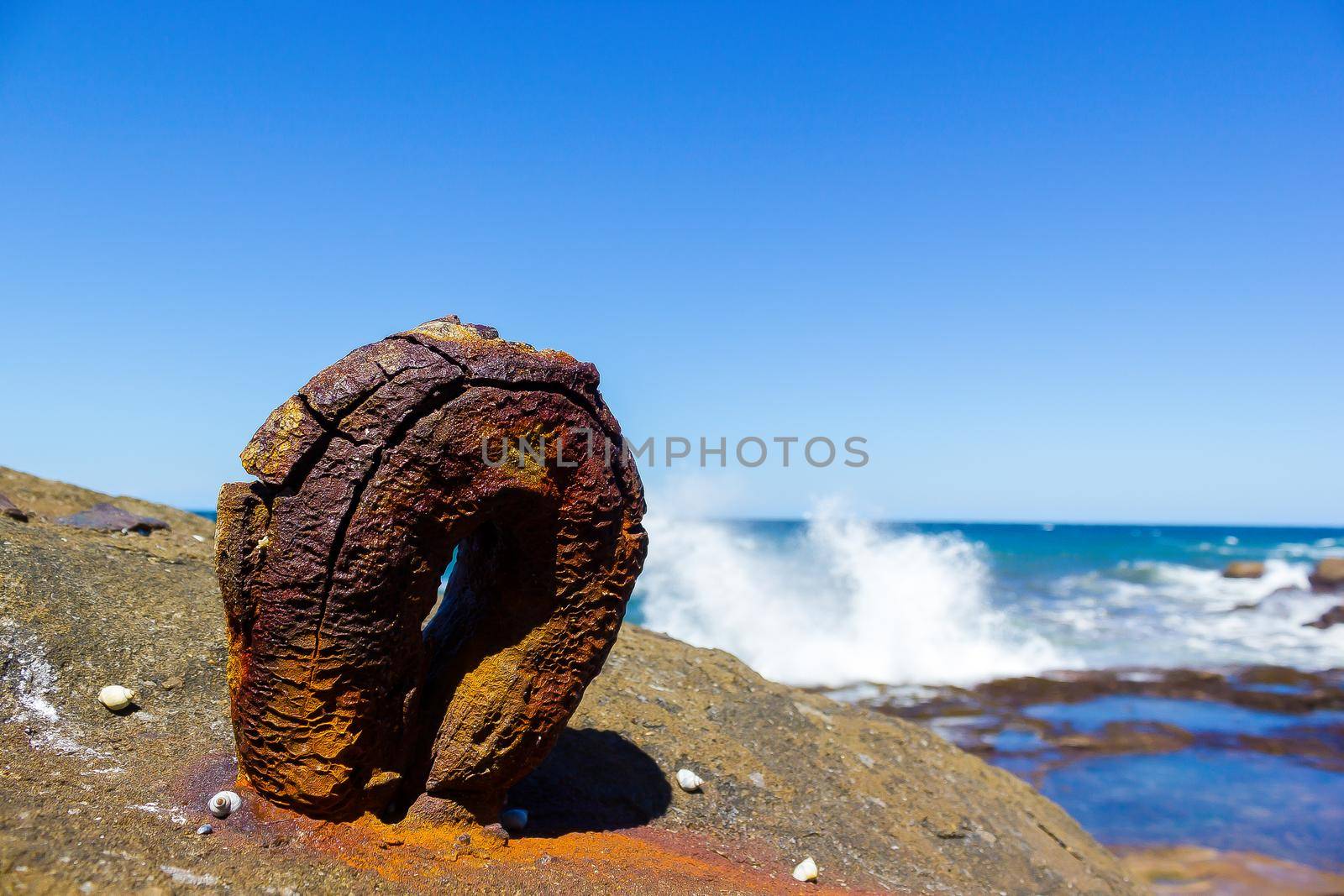 old rusty round hook from the historic Sea Clliff Bridge along the Grand Pacific Drive, Australia by bettercallcurry