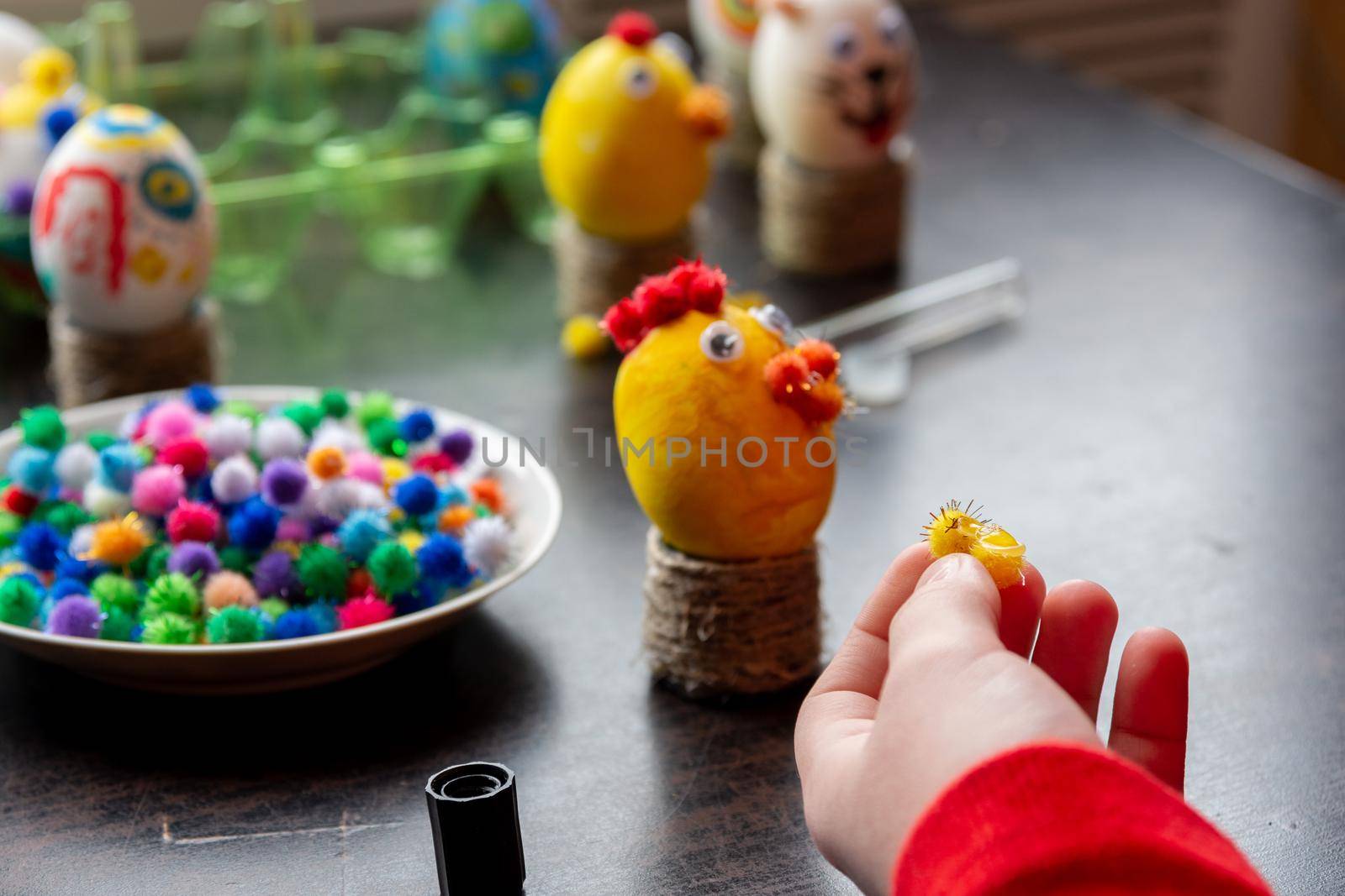 A child makes gifts with his own hands for Easter, a decorative element in the child's cancer