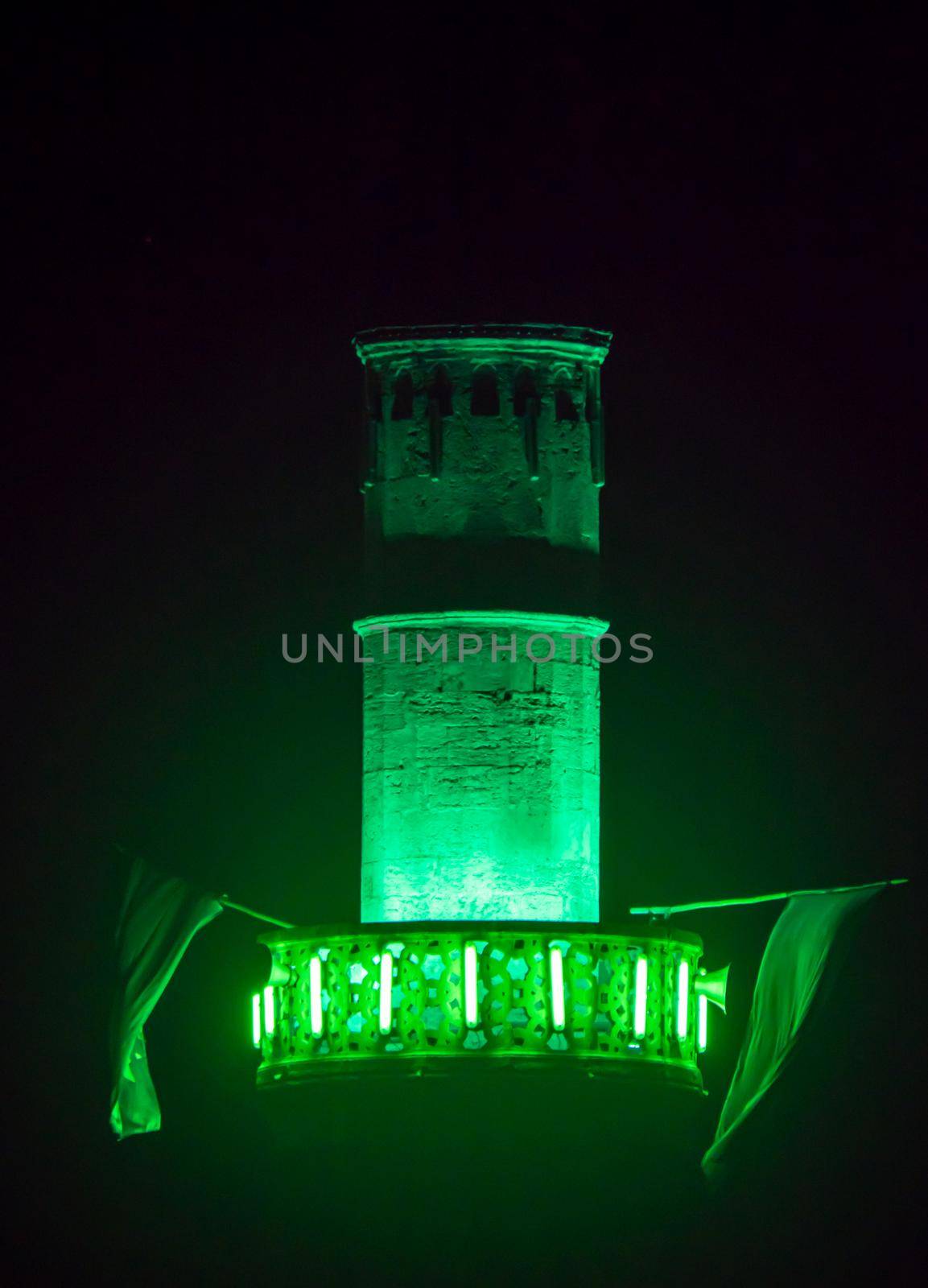 mosque minaret green light at night by alex_nako