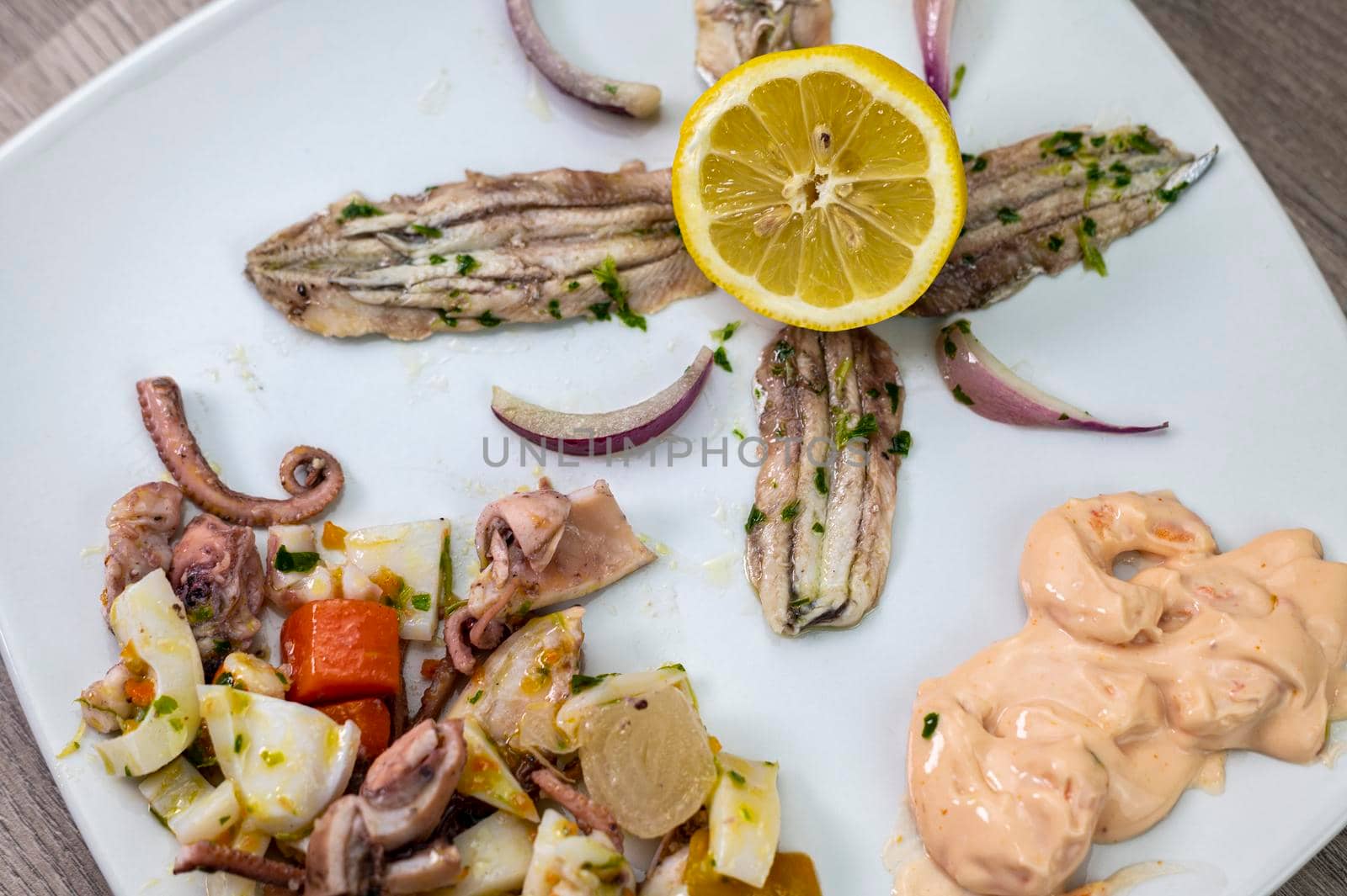 appetizer with seafood goblet of wine and cutlery on wooden background