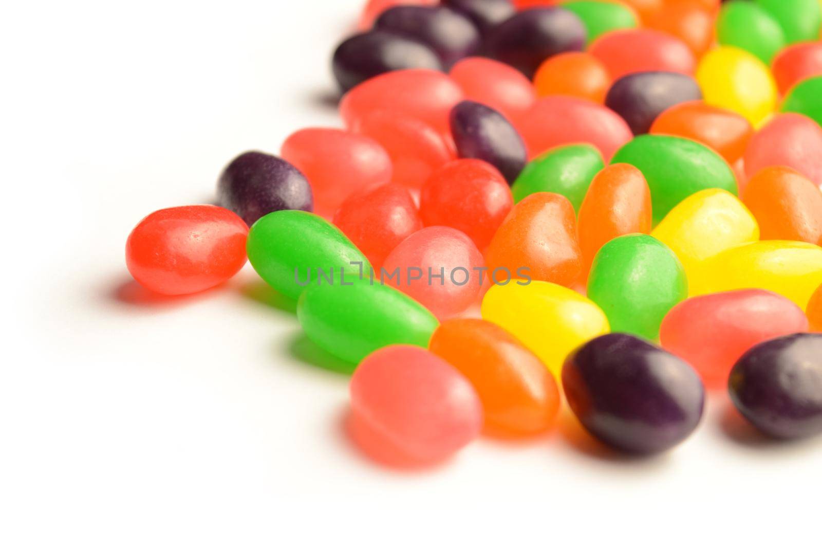 A bunch of jelly bean candy spreading from the corner of the page making an easy insert into your design pages.