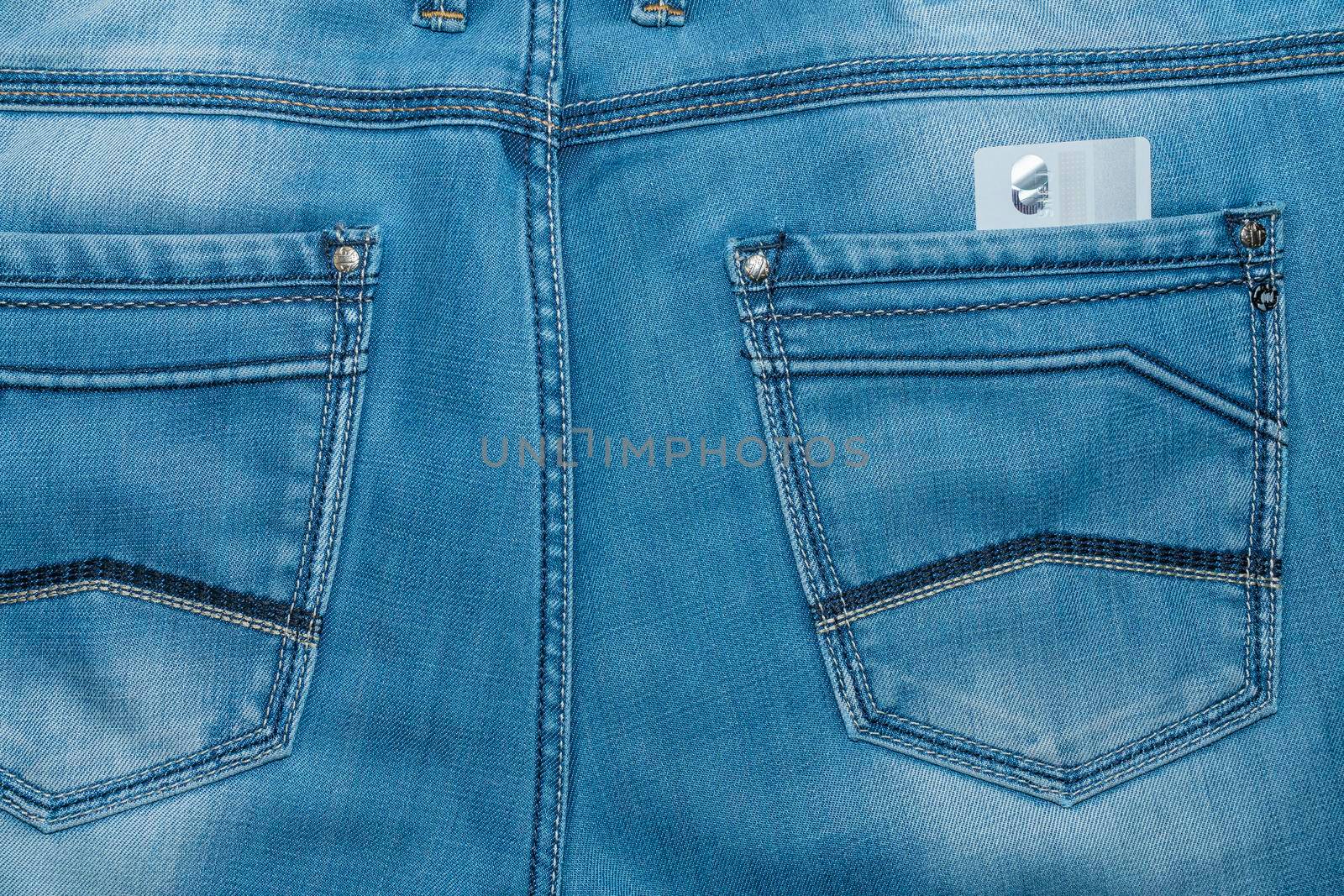bank card in the back pocket of your pants. High quality photo