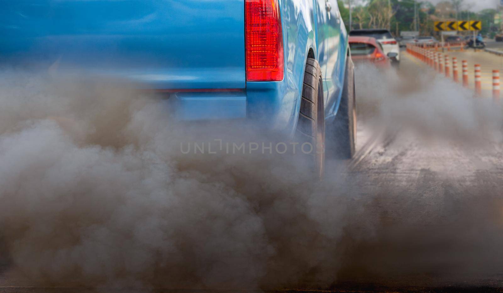 air pollution crisis in city from diesel vehicle exhaust pipe on road   by toa55