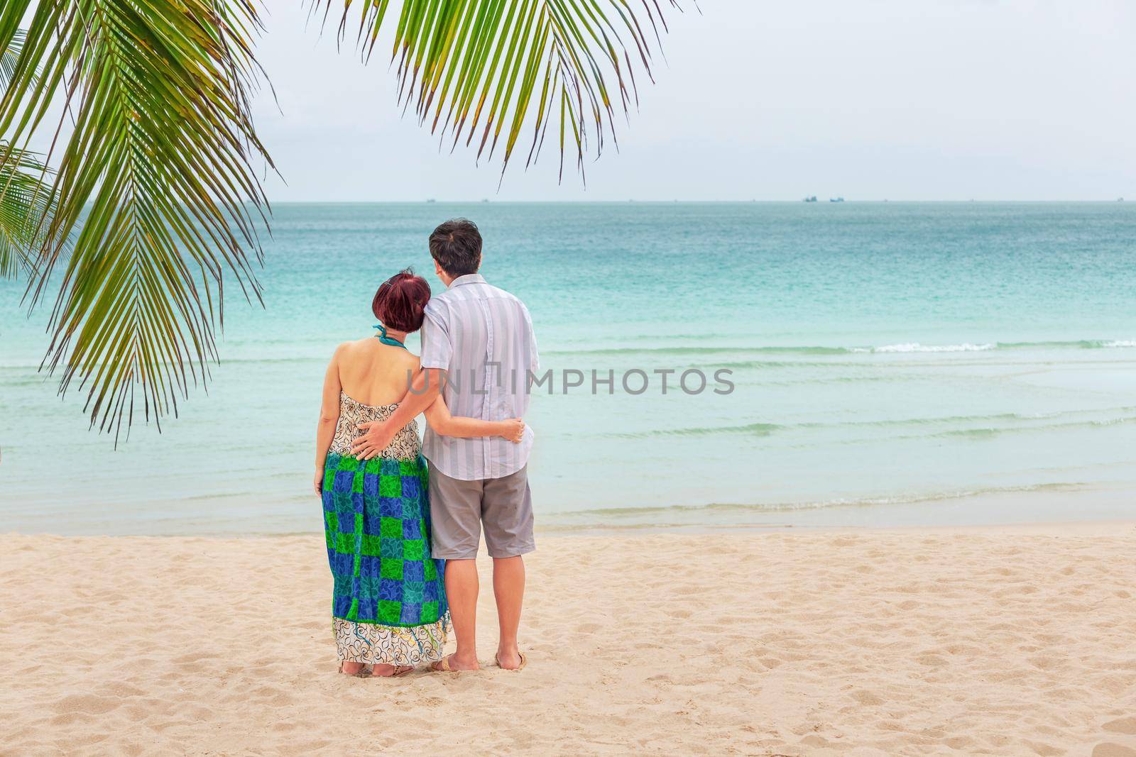 Middle aged couple relaxing at chaweng beach in koh samui ,Thailand.