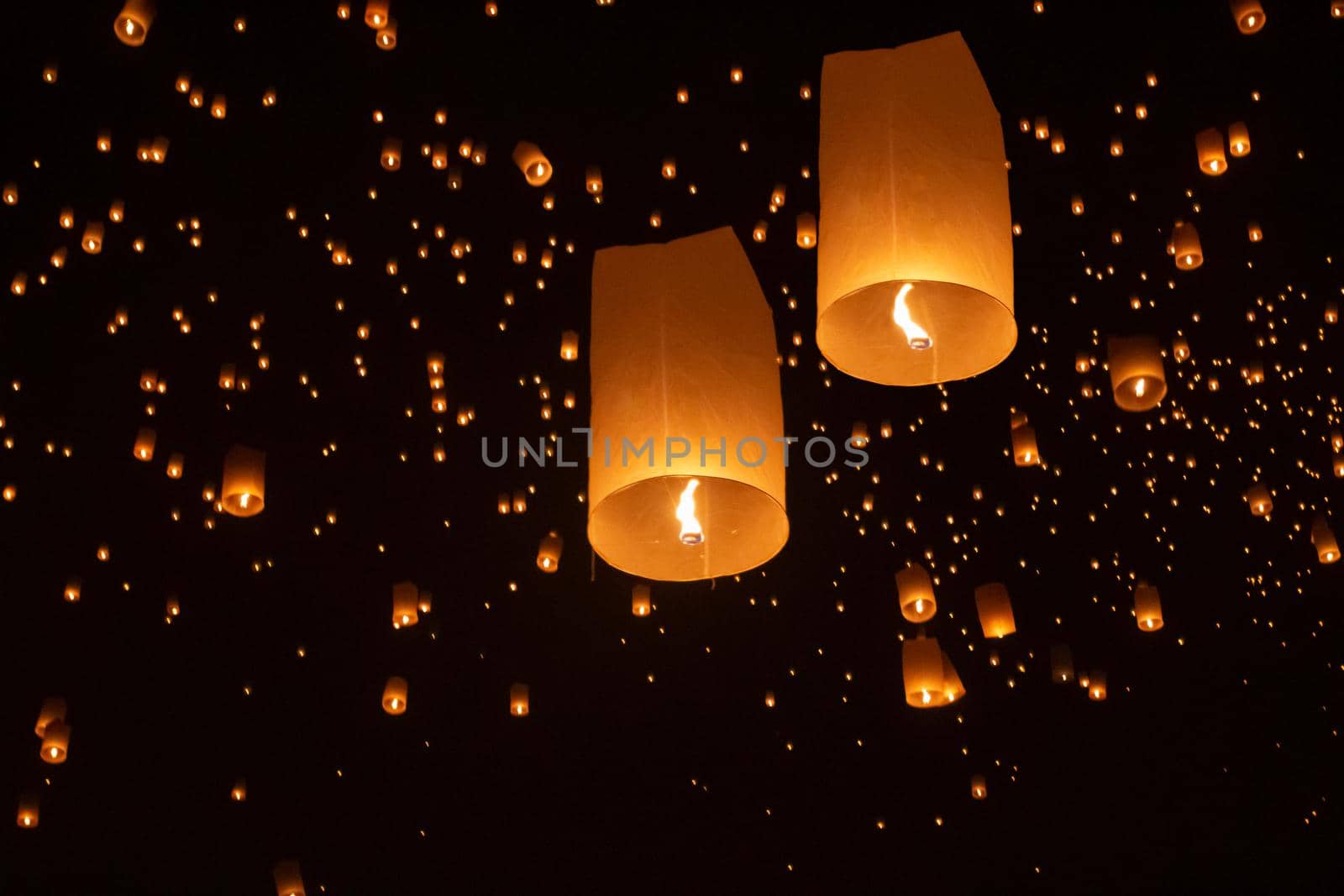 Tourist floating sky lanterns in Loy Krathong festival , Chiang Mai ,Thailand.