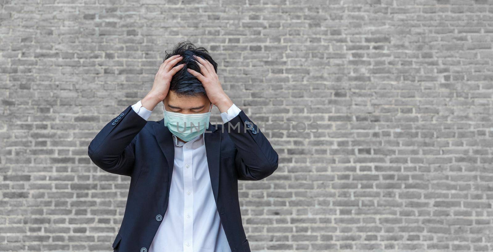 Business man in distress of job losses due to COVID-19 virus pandemic