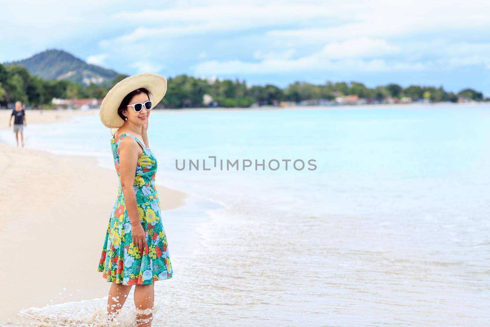 Middle aged woman relaxing at lamai beach in koh samui ,Thailand.