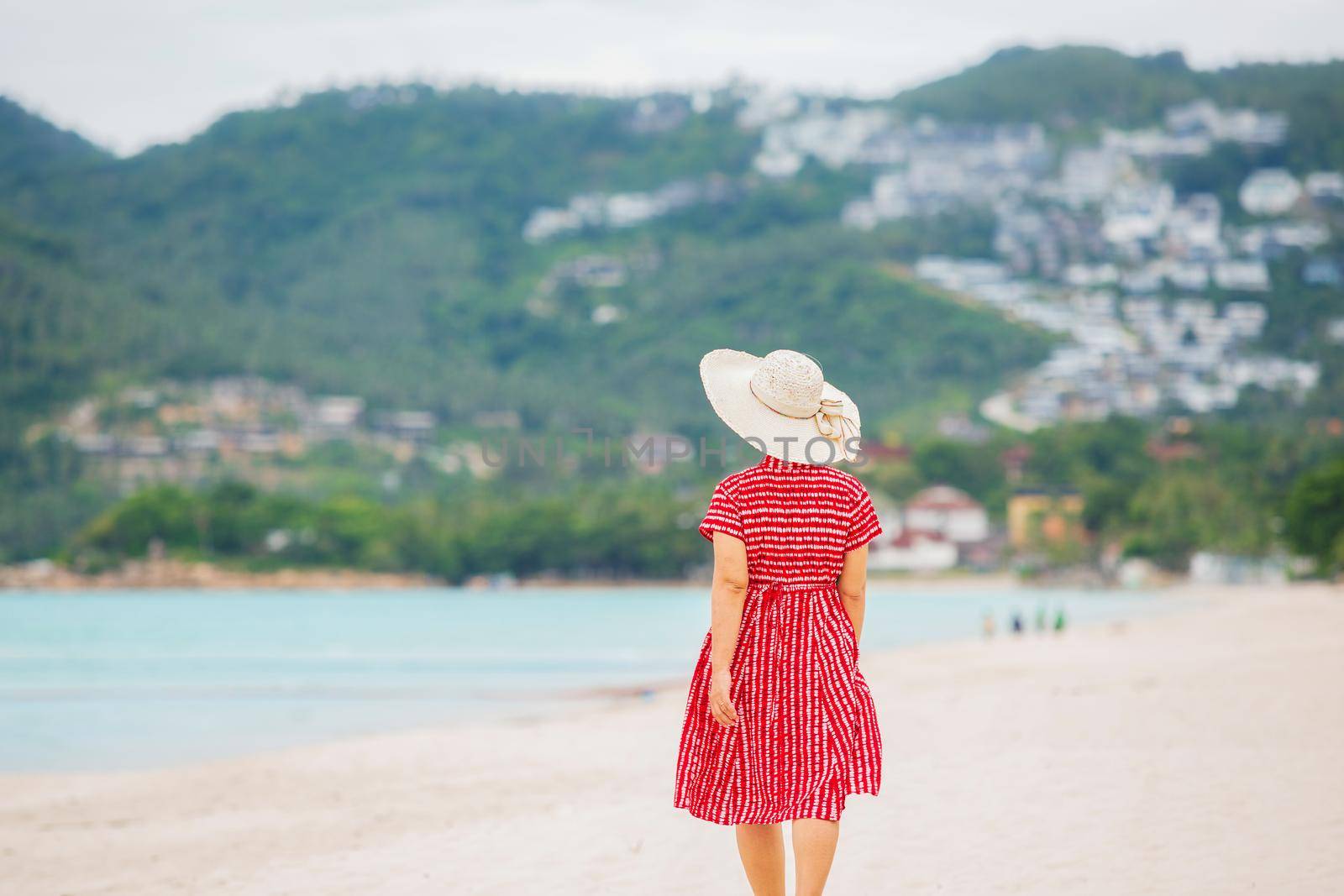 Middle aged woman relaxing at chaweng beach in koh samui ,Thailand.