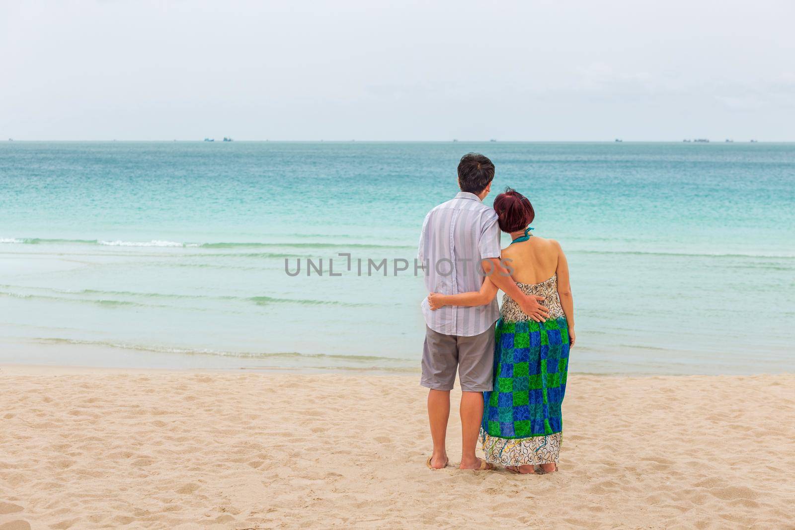 Middle aged couple relaxing at chaweng beach in koh samui ,Thailand.  by toa55