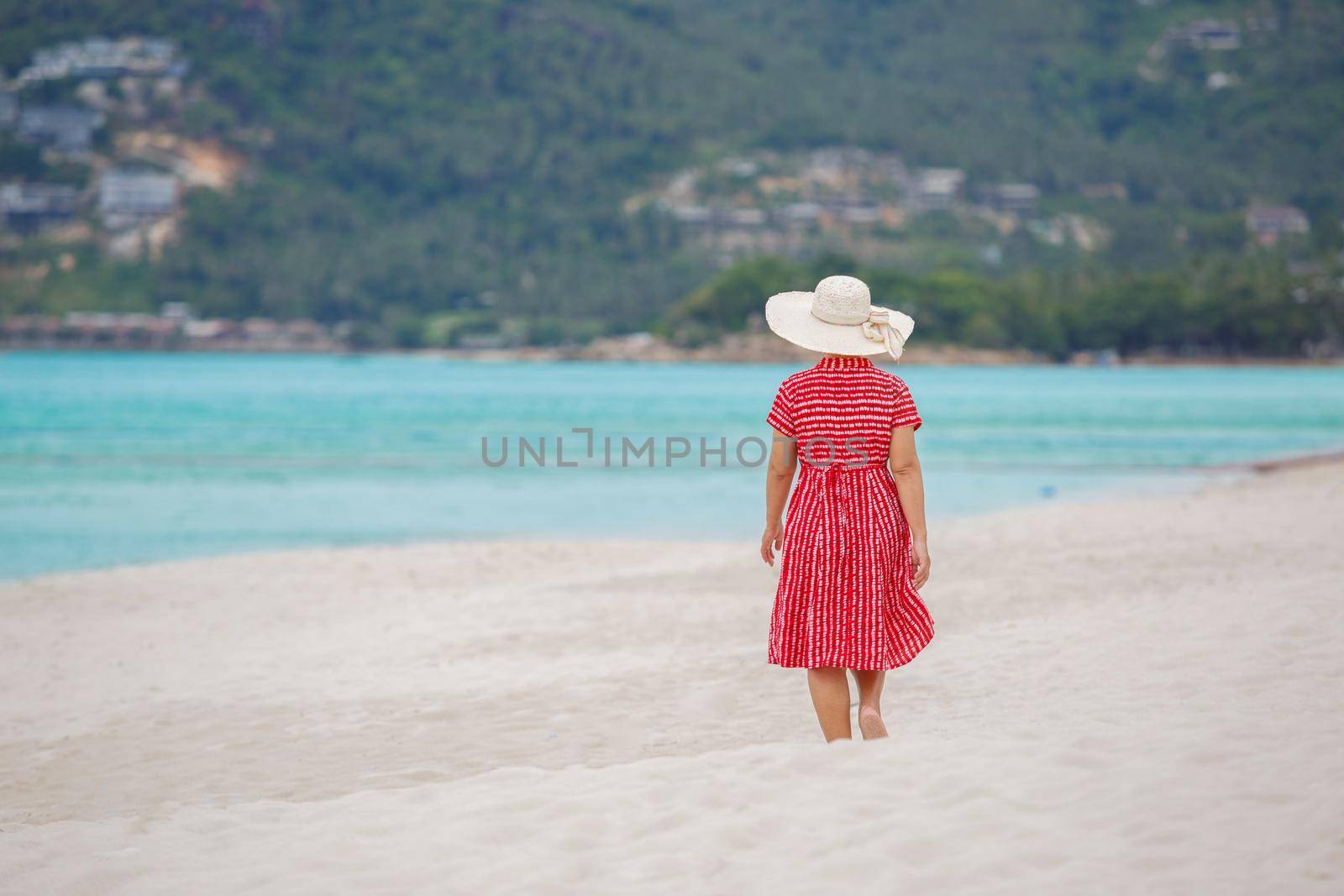 Middle aged woman relaxing at chaweng beach in koh samui ,Thailand. by toa55