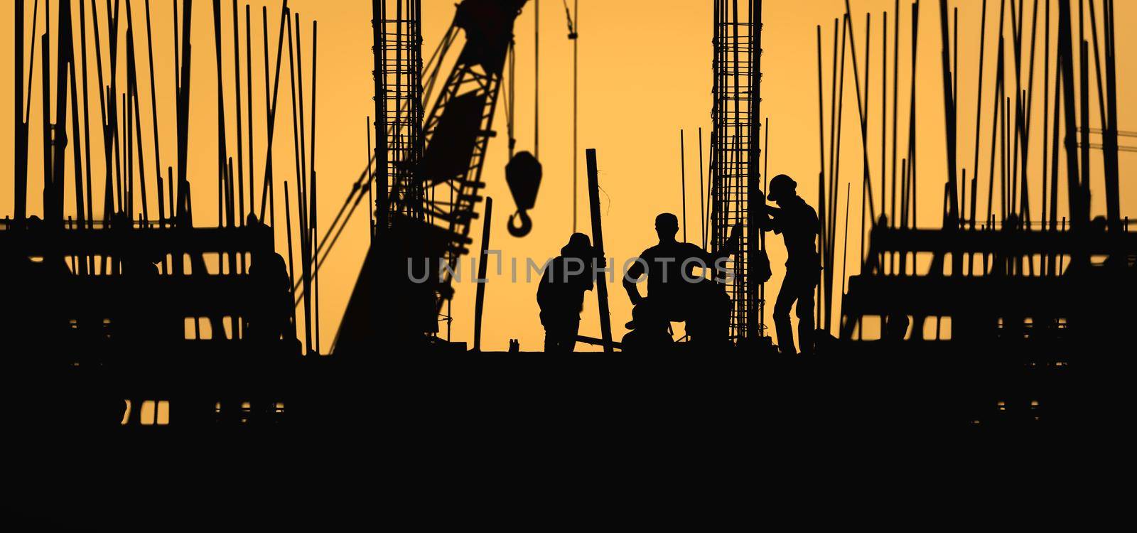 construction worker silhouette on the work place by toa55