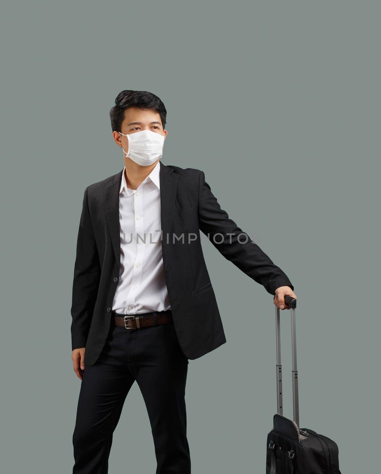 New normal lifestyle ,Business man travelling and wearing face mask protect coronavirus covid-19 by toa55