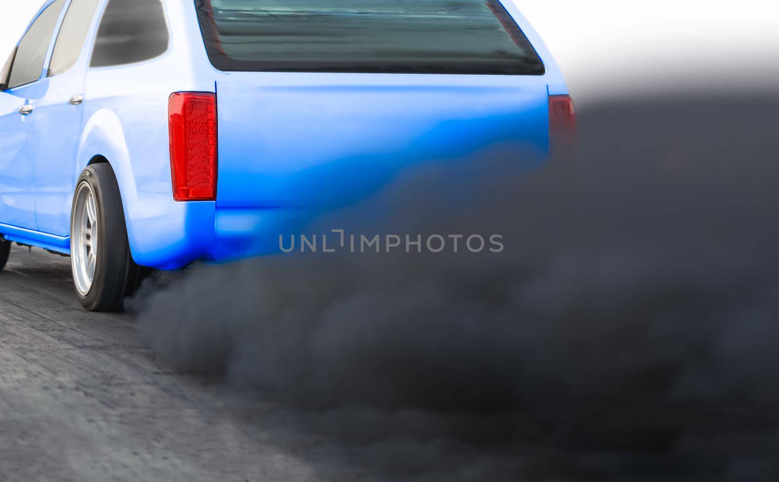 air pollution crisis in city from diesel vehicle exhaust pipe on road